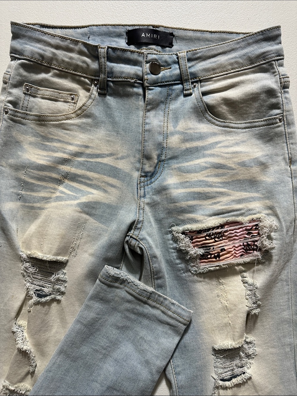 AMIRI Light Blue Distressed Jeans with Pink Patch Detail